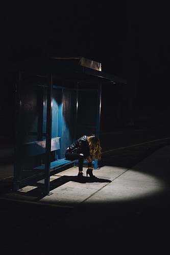los angeles woman sitting on black weight bench during night time united states